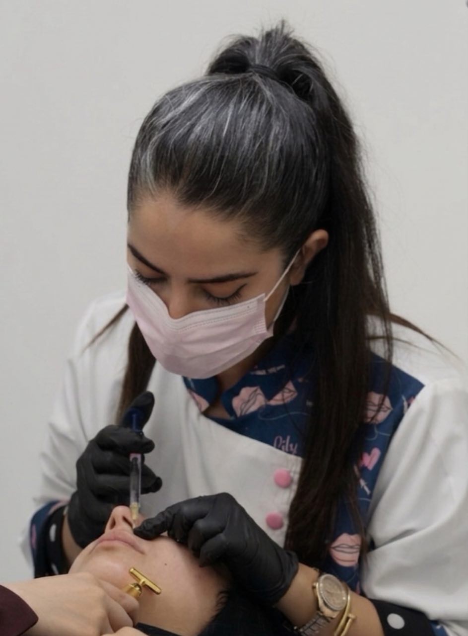 Zahra carrying out an aesthetic treatment at Infinity Derma Clinic
